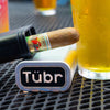 Tübr aluminum cigar tube with cigar and logo badge