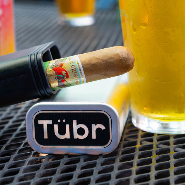 Tübr aluminum cigar tube with cigar and logo badge