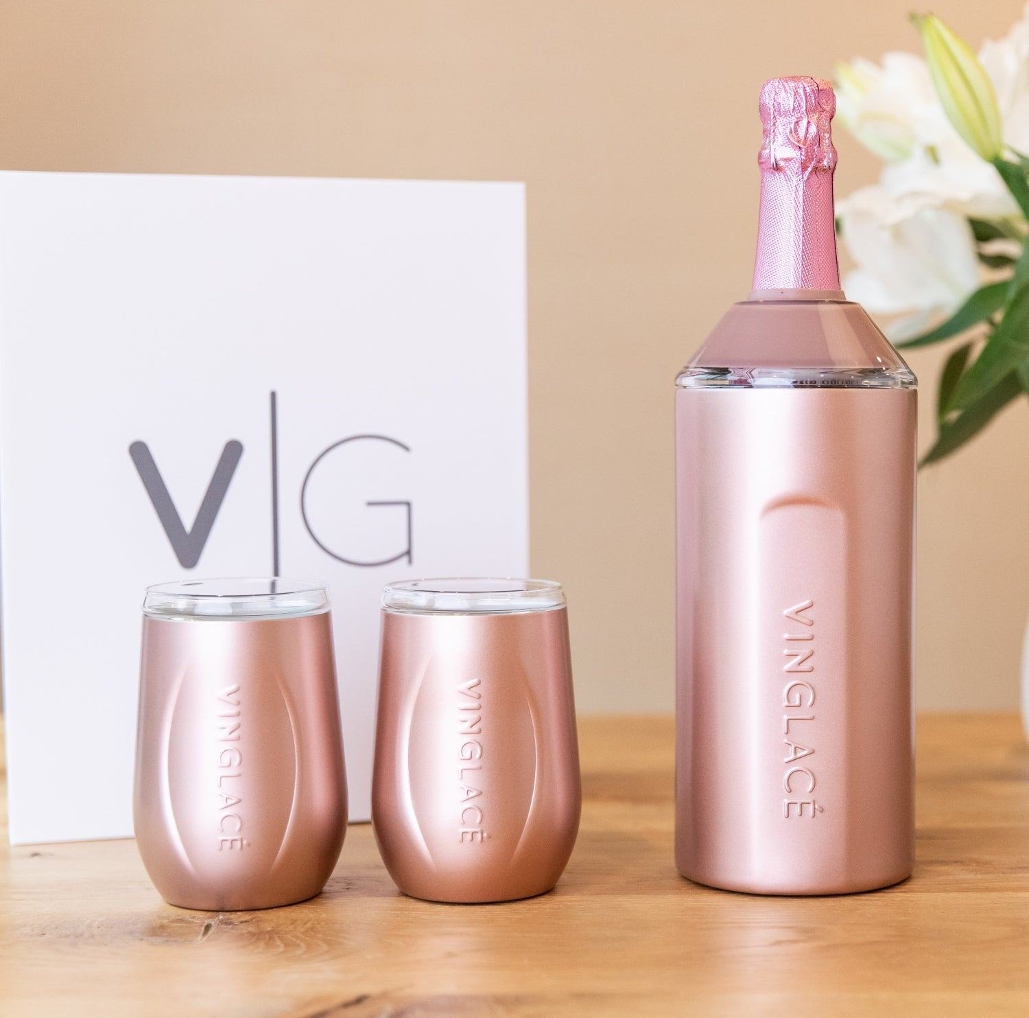 Rose gold bottle cooler with two matching tumblers