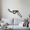 Black Suzuka circuit metal wall art above a light blue sofa