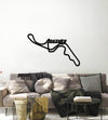Black Suzuka circuit wall art above a gray living room sofa