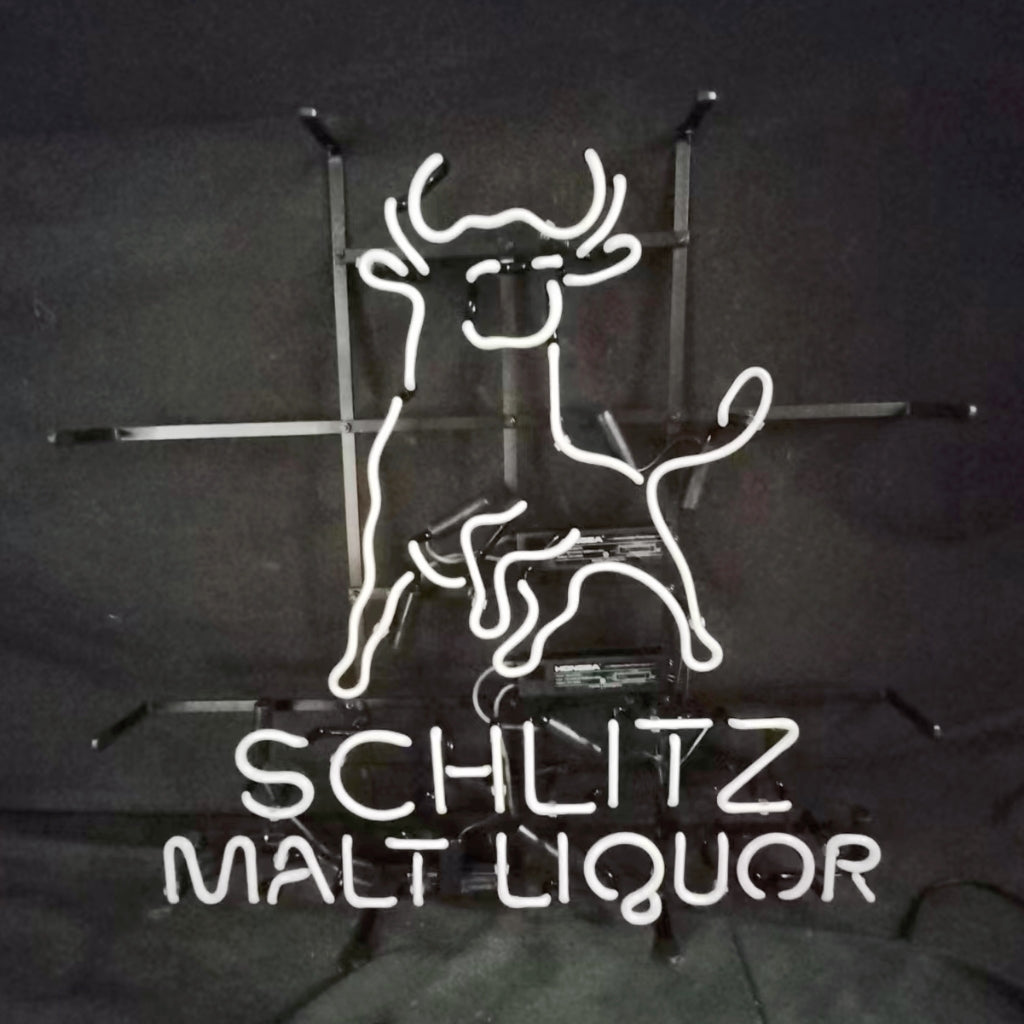 Neon Schlitz Malt Liquor sign with smiling horse outline on metal stand, white neon outline