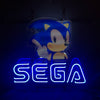 Front-facing blue Sega-style neon sign with glowing 'SEGA' letters