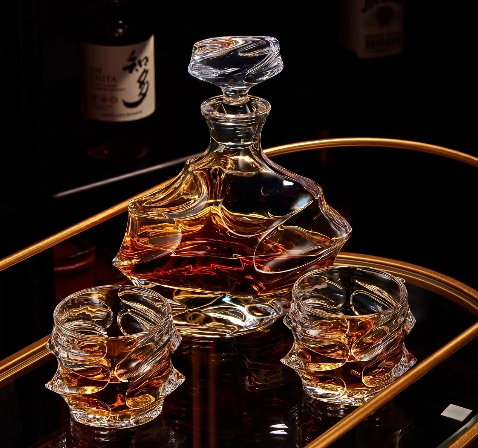 Crystal whisky glass set with bottle and three glasses on a serving tray