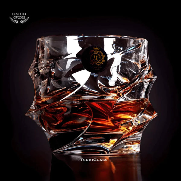 Faceted crystal whisky glass with amber pour, close-up view
