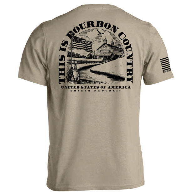 Tan short-sleeve T-shirt with large back graphic print and striped sleeve patch text
