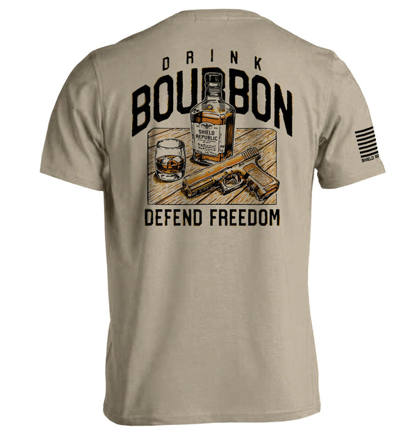 Beige crewneck tee with back Drink Bourbon graphic, whiskey bottle and DEFEND FREEDOM