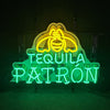 Neon acrylic sign 'TEQUILA PATRON' with Patron face logo, yellow and green.