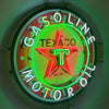 Gasoline oil neon sign with Texaco star, green halo, and outer ring lettering