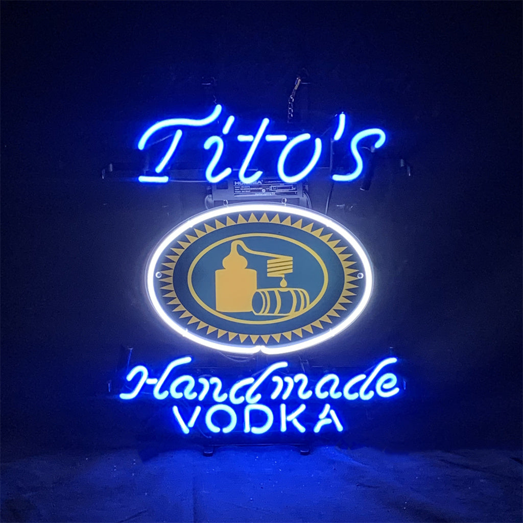 Blue neon sign: oval emblem with glowing 'Tito's' and 'Vodka' text