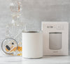 White glass-lined lowball whiskey tumbler with lid, plus VINGLACE product box in view