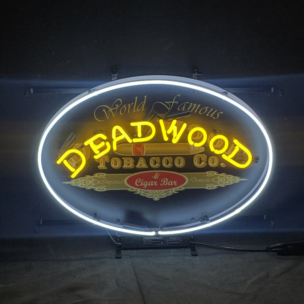 Oval neon light sign featuring 'World Famous' and 'Deadwood Tobacco Co.' branding