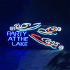 Neon sign with yacht outline and text “PARTY AT THE LAKE” in blue and red