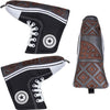 Black canvas putter cover with white laces and star patch, brown patterned top