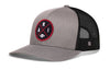 Heather gray front trucker hat with red round logo patch, black mesh sides, snapback.