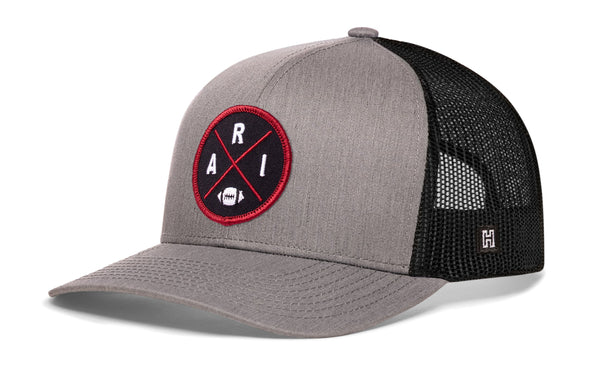 Heather gray front trucker hat with red round logo patch, black mesh sides, snapback.