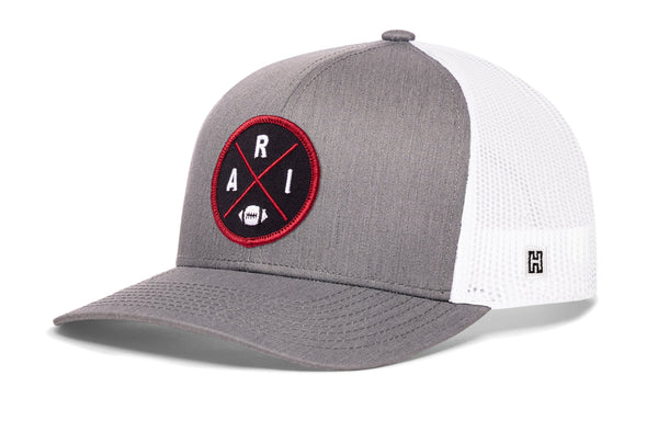 Heather gray front trucker hat with red round logo patch, white mesh sides, snapback.