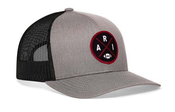 Heather gray front trucker hat with red round logo patch, black mesh sides, snapback.