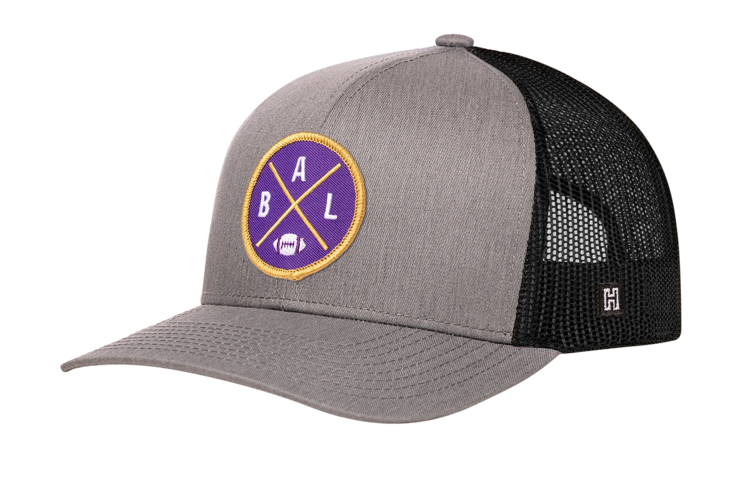 Gray and black trucker snapback hat with round BALX logo patch and mesh side panels