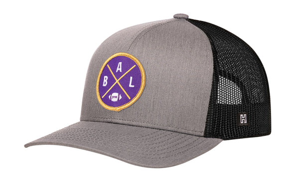 Gray and black trucker snapback hat with round BALX logo patch and mesh side panels