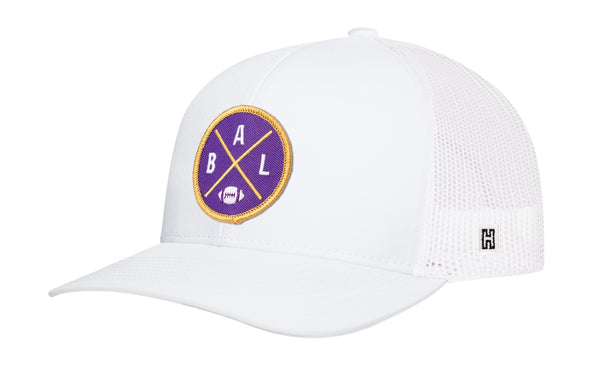 White trucker snapback hat with round BALX logo patch and mesh side panels