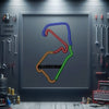 Neon metal race track sign with colorful outline and Silverstone logo inside a frame