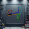 Framed metal neon race track sign with multicolor glowing track lines