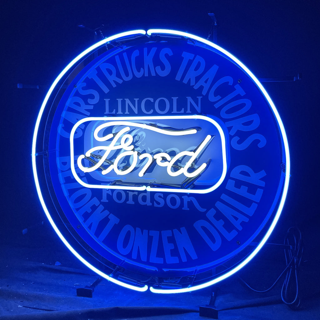 Round blue neon sign with “Ford” script, “Lincoln” lettering, and glowing ring