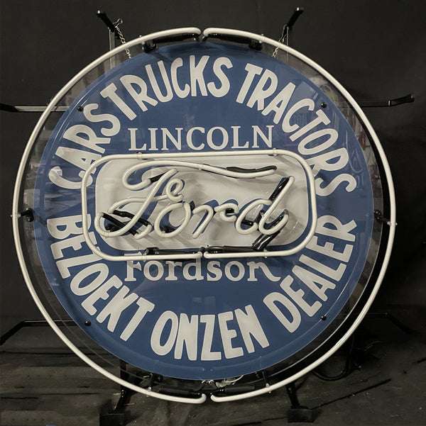 Round blue neon sign with white border ring, “Ford” script and “Lincoln” lettering