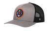Gray trucker hat with orange logo patch and black mesh back, snapback strap