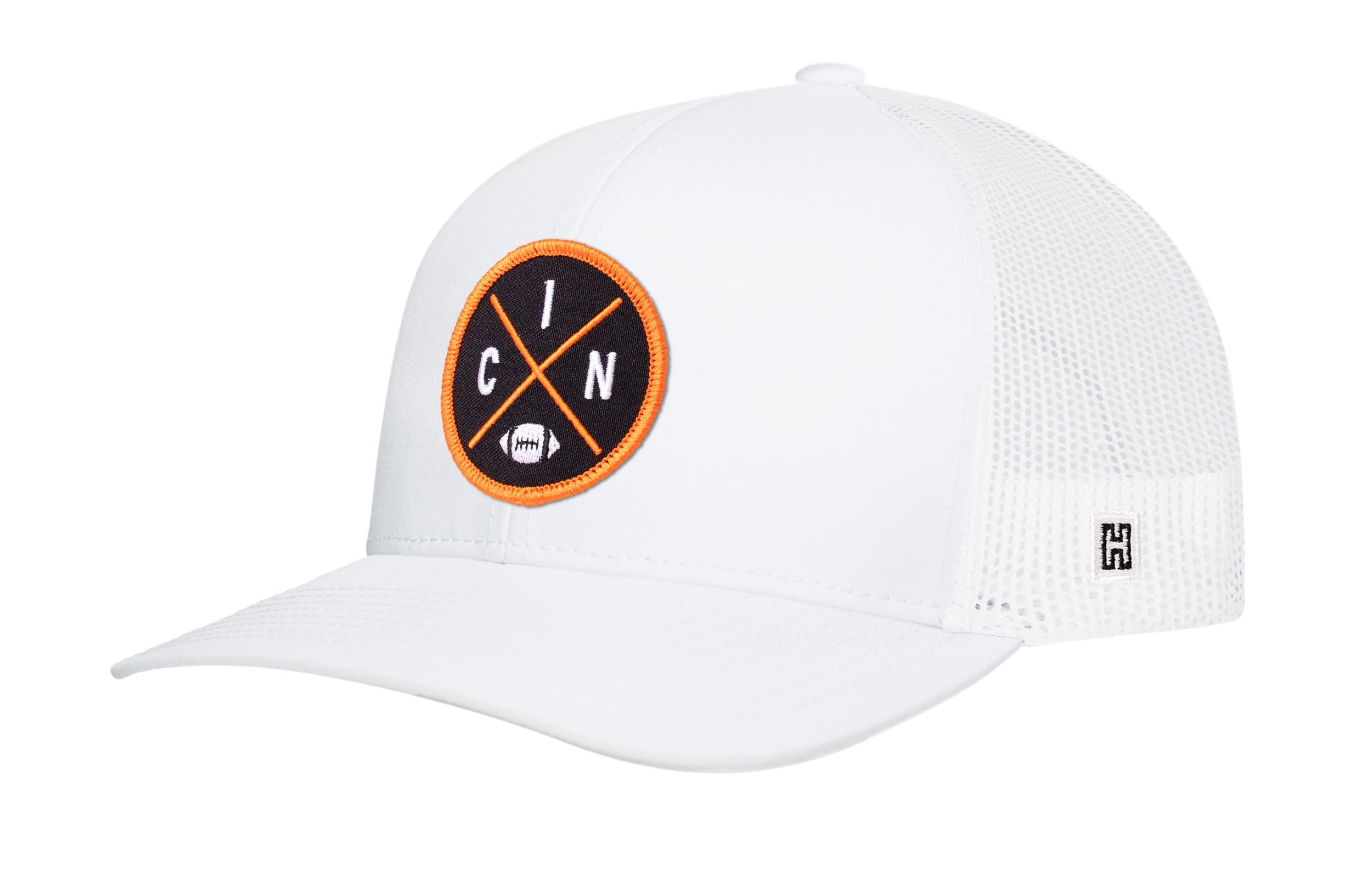 White trucker snapback cap with orange circular logo patch and mesh back.
