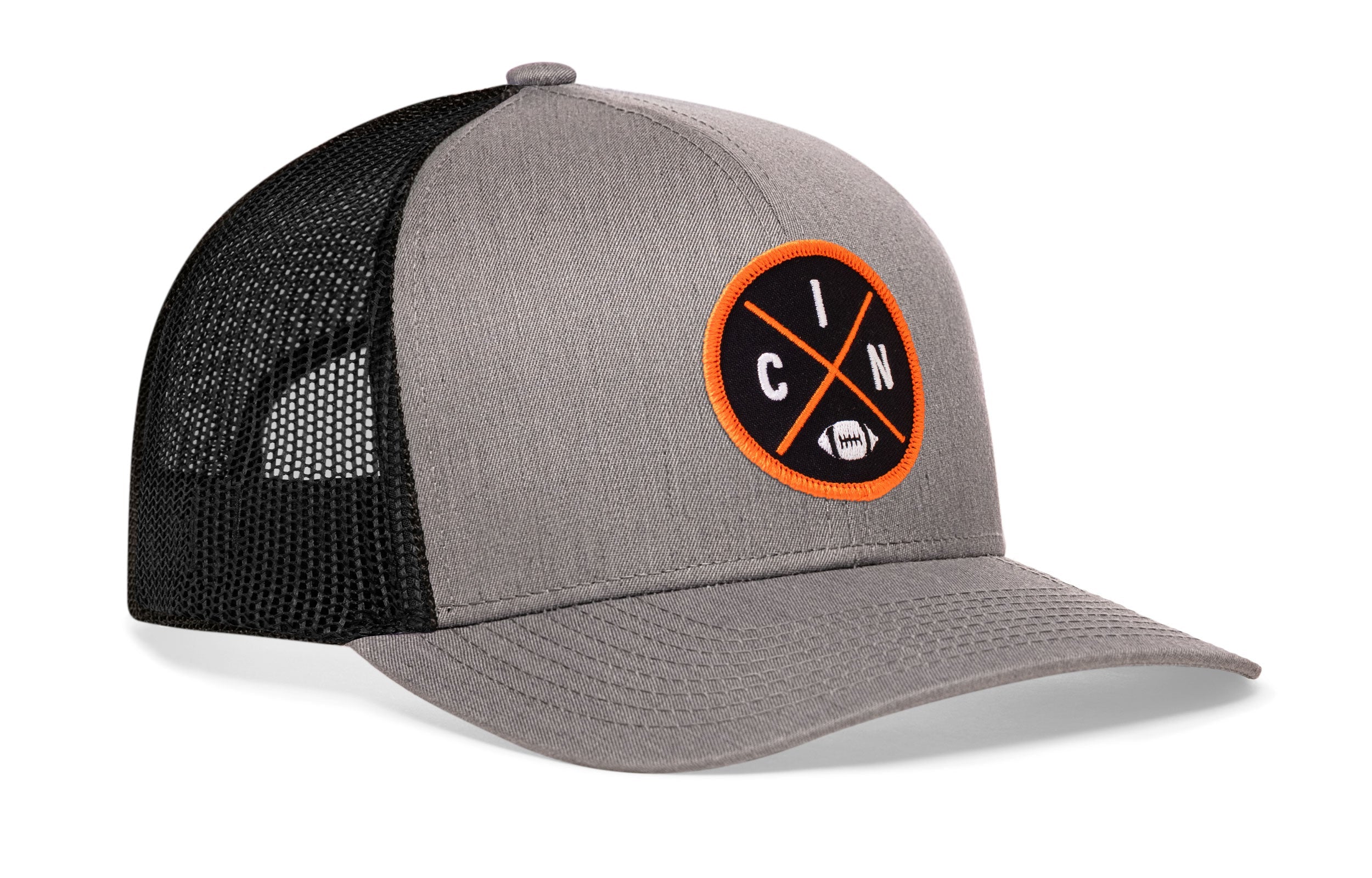Gray trucker cap with black mesh back, curved brim, and orange circular logo patch.