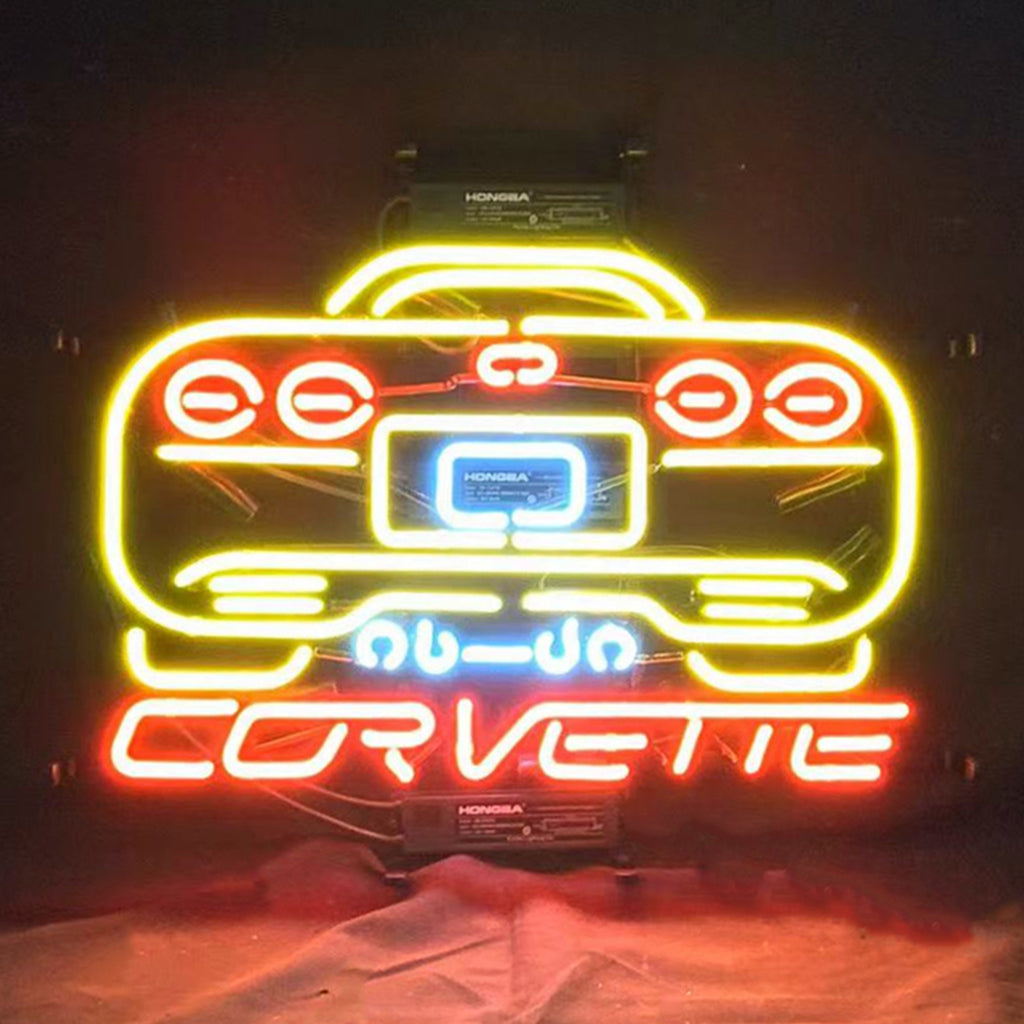 Yellow and red neon corvette car sign with glowing grille and headlights