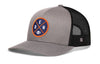 Gray trucker hat with round DEN X logo patch and black mesh side panels