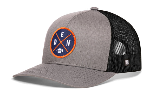 Gray trucker hat with round DEN X logo patch and black mesh side panels