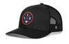 Black trucker hat with round DEN X logo patch and black mesh side panels