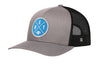 Gray and black trucker hat with blue DET X logo patch, curved brim, and mesh back.