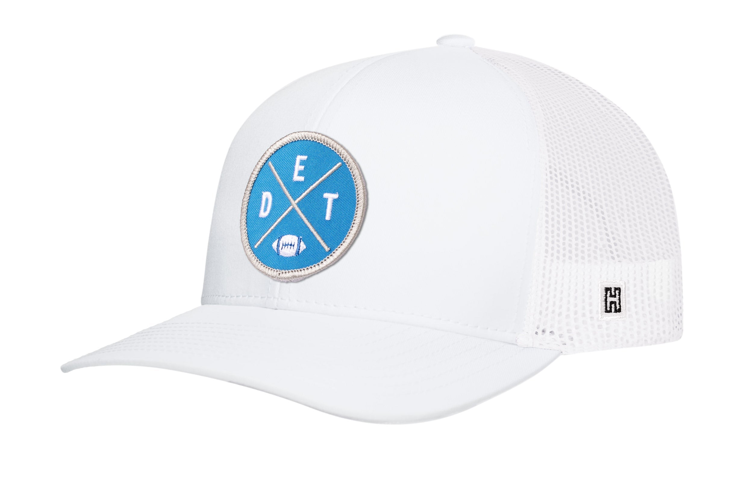 White trucker hat with blue DET X logo patch, curved brim, and mesh back panel.