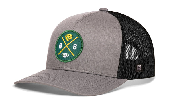 Gray trucker hat with green GB logo patch and black mesh side panels.