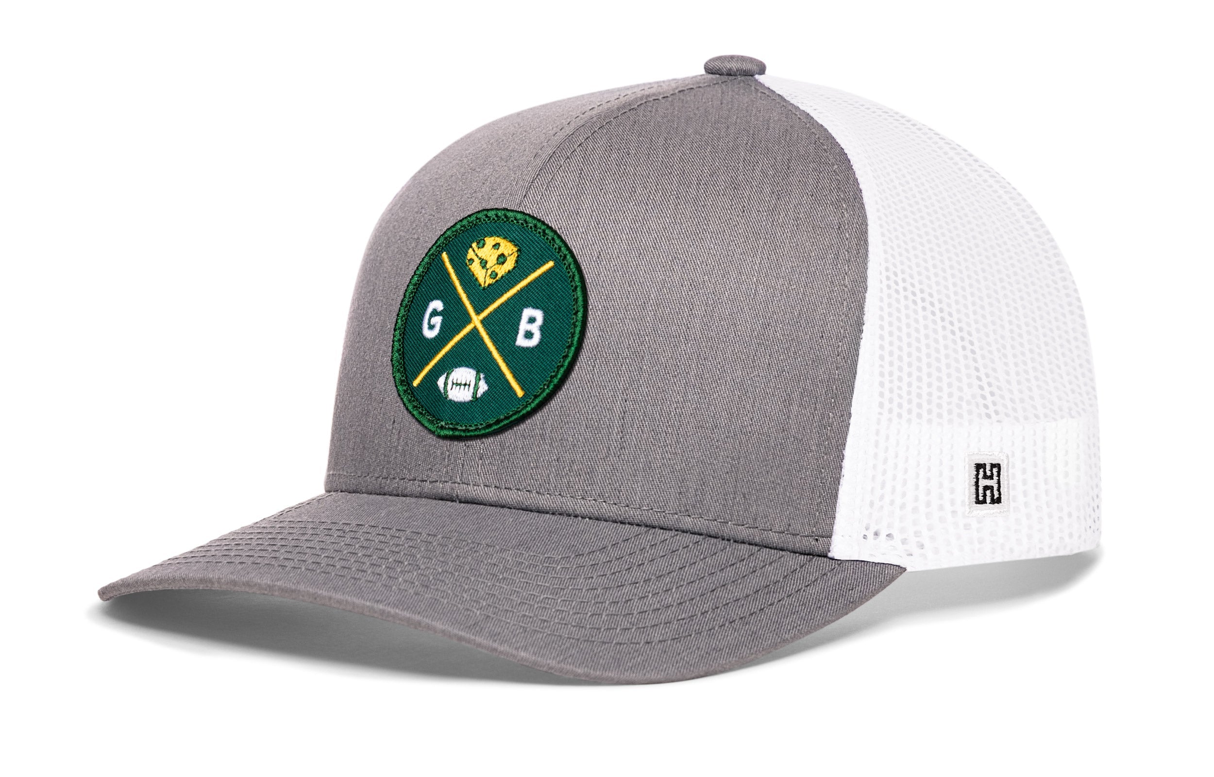 Gray-and-white trucker hat with green GB logo patch and mesh side panels.