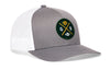 Gray-and-white trucker hat with green GB logo patch and mesh side panels.