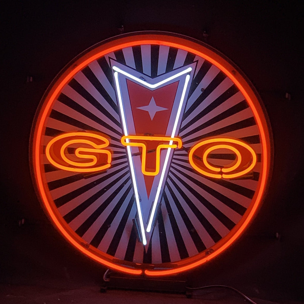 Round neon light sign with orange and yellow GTO letters, star badge, red ring