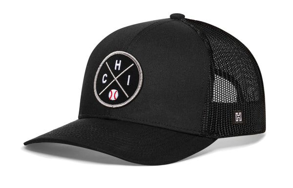 Black trucker baseball cap with round front logo patch and mesh snapback back