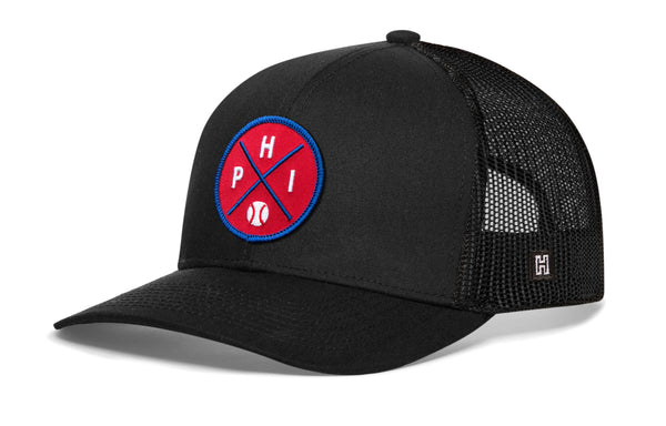 Black trucker hat with front logo patch, curved brim, and mesh back panel