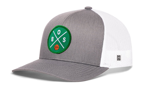 Gray and white basketball trucker hat with green B.S. patch and side H