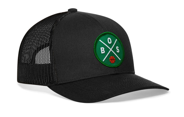 Black basketball trucker hat with green B.S. logo patch on front mesh panel