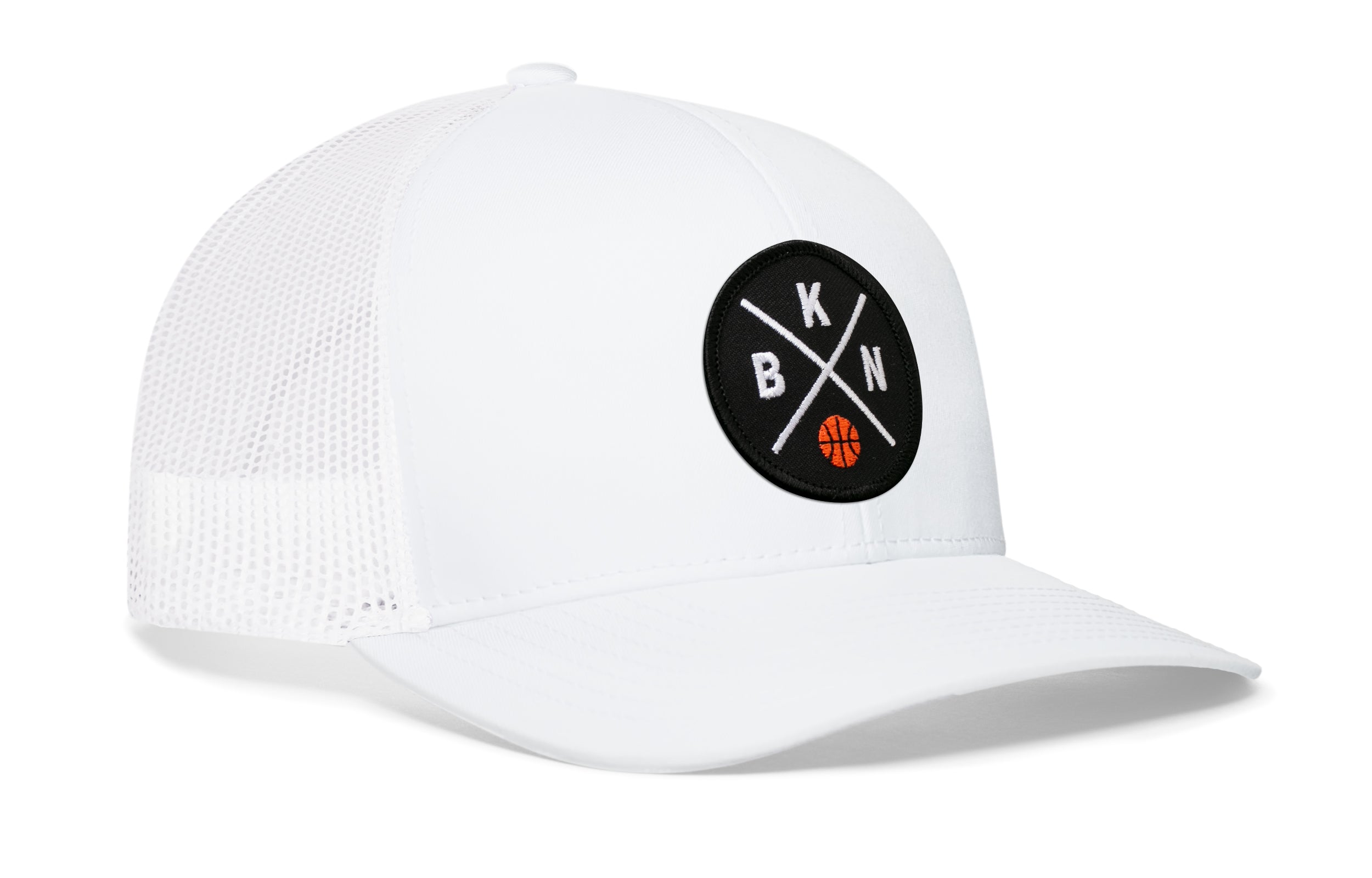 White trucker cap with circular front logo patch, white mesh side panels, curved brim