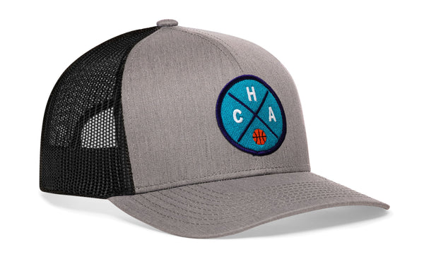 Gray front basketball trucker hat with black mesh back and blue logo patch