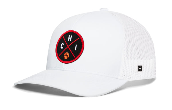 White trucker snapback cap with mesh back, curved brim, and red circular front logo