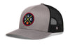 Gray front trucker cap with black mesh back and circular logo patch